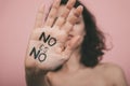 Girls`s hand with vindictive painted letters. Feminism concept. Royalty Free Stock Photo