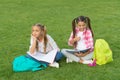 Girls school pupils doing homework together on fresh air, dreams about future concept