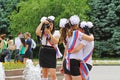 Girls in school uniform, the bows and the ribbon `Graduate` make a picture for memory on celebration of the Last Call in Volgograd