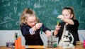 Girls school uniform excited proving their hypothesis. Gymnasium students with in depth study of natural sciences