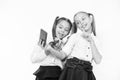 Girls school uniform take selfie smartphone. Posing to take perfect photo. Girlish leisure. Girls just want to have fun