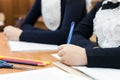 Children write an examination paper at school.