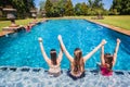 Girls Seated Swimming Pool