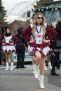 Girls with sexy costume of cheerleader parading in the street Royalty Free Stock Photo