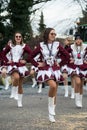 Girls with sexy costume of cheerleader parading in the street Royalty Free Stock Photo