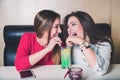 Girls share fruit cocktail Royalty Free Stock Photo