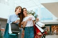 Girls Shopping. Female Friends In Mall