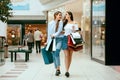 Girls Shopping. Female Friends In Mall