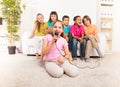 Girls singing in front of her friends Royalty Free Stock Photo