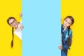 Girls sisters holding blue empy poster and smiling. Copyspace Royalty Free Stock Photo