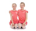 Girls sisters sit on the floor Royalty Free Stock Photo