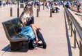 Girls are sitting on a bench, Sydney, Australia. With selective focus