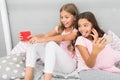 Girls smartphone little bloggers. Online entertainment. Explore social network. Smartphone for entertainment. Kids