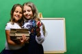 Girls with smiling faces and stationery. Back to school Royalty Free Stock Photo