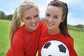 Girls, soccer players and portrait with ball, field and football pitch for match, competition or game. Fitness, practice Royalty Free Stock Photo