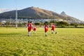 Girls, soccer team or fitness game on grass field in workout, training or exercise for game or match goals. Running Royalty Free Stock Photo