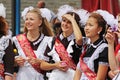 Girls in soviet school uniform, the bows and the ribbon `Graduate` on celebration of the Last Call in Volgograd