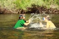 Girls splashing in the river Royalty Free Stock Photo