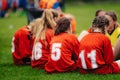 Girls in sports soccer team outdoors. Female physical education class on sports grass field.