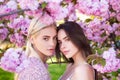 Girls in spring flowers. Fashion cosmetics and perfumes. Royalty Free Stock Photo