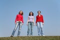 Girls stand on meadow