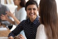 Girls students do common exercise task sitting at desk indoors