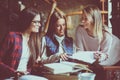 Girls students teaching in cafe together. Royalty Free Stock Photo