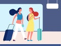 Girls with suitcases. Young travellers in airport or bus station. Female passengers with luggage on station waiting Royalty Free Stock Photo