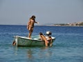 Girls in summer vacation on boat in sea Royalty Free Stock Photo