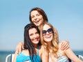 Girls sunbathing on the beach chairs Royalty Free Stock Photo