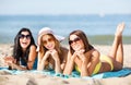 Girls sunbathing on the beach Royalty Free Stock Photo