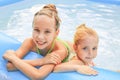 Girls swimming in the pool.