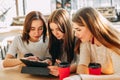 Girls with tablet pc watching online content Royalty Free Stock Photo