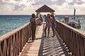 Girls take a picture with their smartphone on the Dominicus pier at sunset Royalty Free Stock Photo