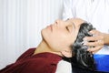 Girls taking hair bath in salon by a professional Royalty Free Stock Photo