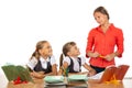 Girls at their desks have fun watching their beloved teacher