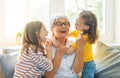 Girls and their grandmother enjoying sunny morning Royalty Free Stock Photo