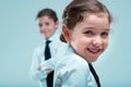 Girls in ties discuss business, prioritize play