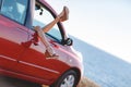 Girls - travelers relaxing in the car