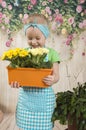 Girls twins of three years care for flowers, Royalty Free Stock Photo