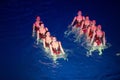 The girls in two rows in pool at Show Olympic champions