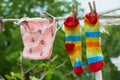 female underwear and socks air drying on the clothes line outside in the backyard