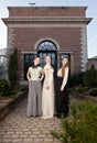 Girls in Victorian in front of old house Royalty Free Stock Photo