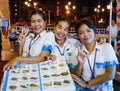 Girls waitresses in seafood restaurant at night