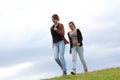 Girls walking down a grassy hill