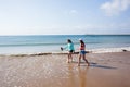 Girls Walking Beach Shoreline Ocean Royalty Free Stock Photo