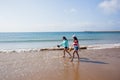 Girls Walking Beach Shoreline Ocean Royalty Free Stock Photo