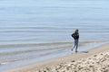 Girls walks the shores of Siletz Bay