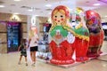 Girls are watching the window with Russian Souvenirs in the form