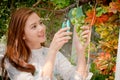 The girls were cutting a bunch of grapes , green and purple grape